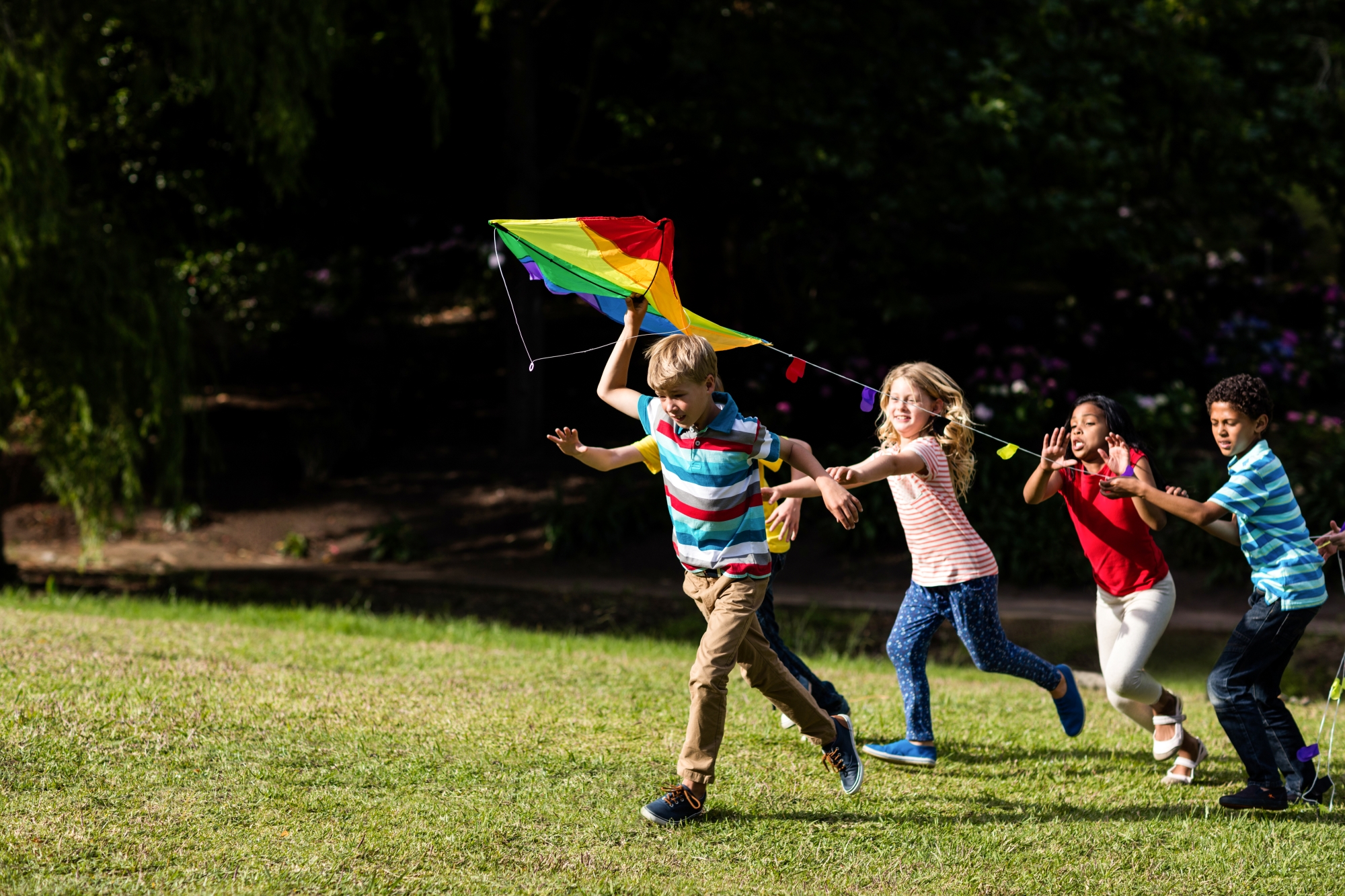 Children playing with kite in the concept of amenities and services in Battersea for new residents