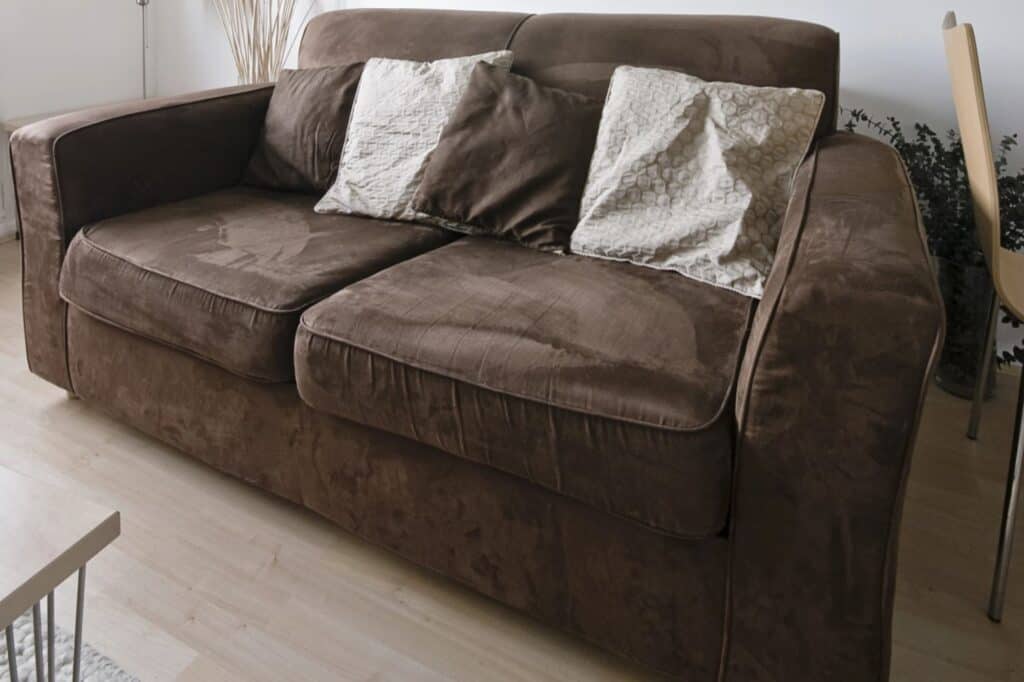 A bulky brown sofa